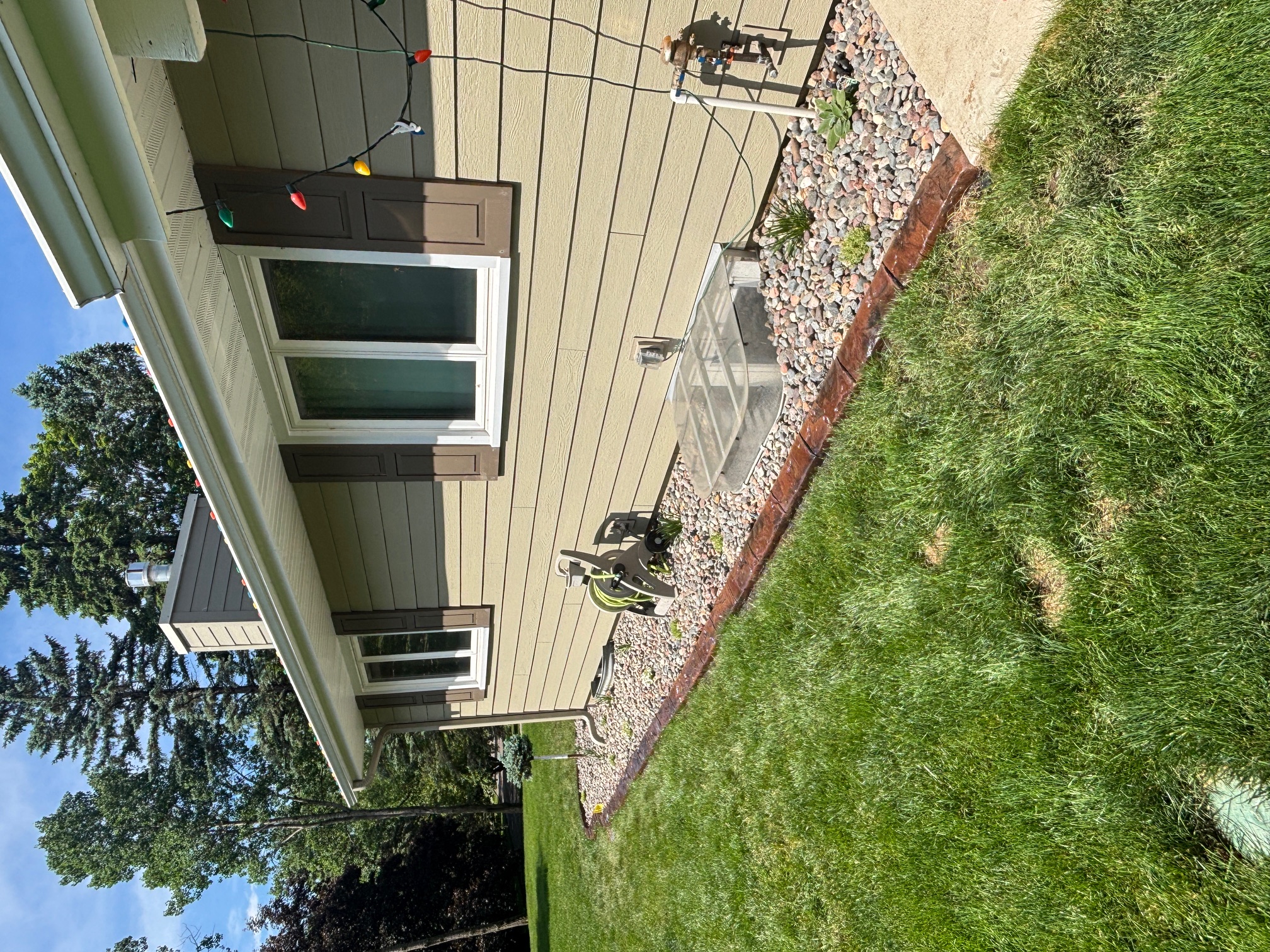 After - curved stamped curbing around patio and retaining wall